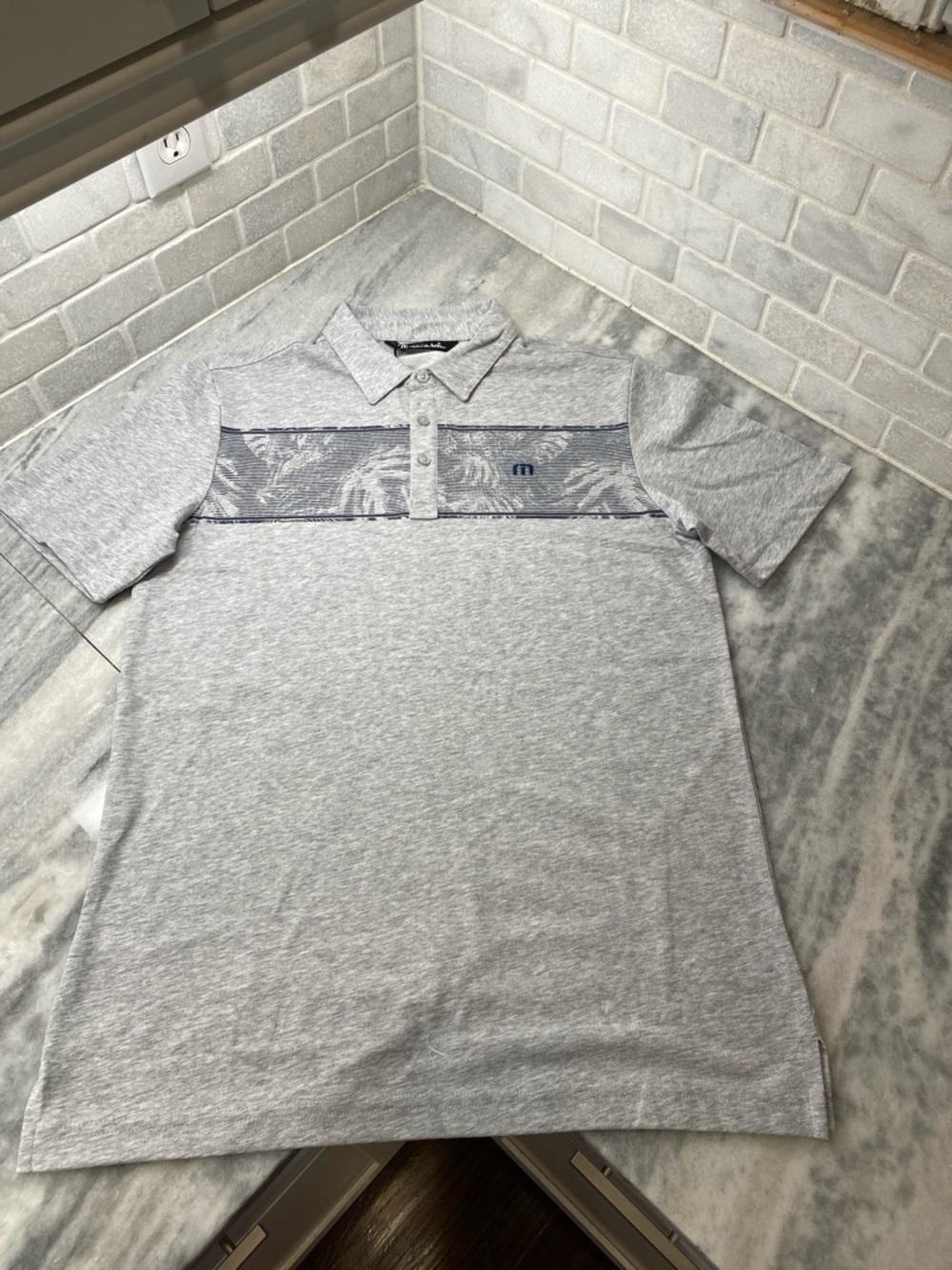 Travis Mathew Light Gray Polo with Navy Patterned Chest Stripe